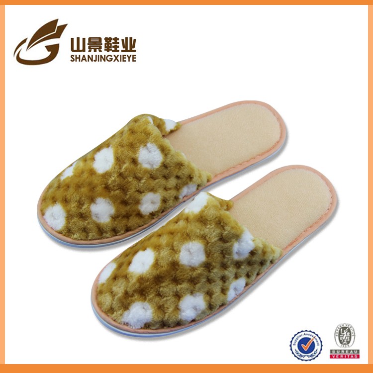 Large supply of low-cost household terry cloth indoor slippers