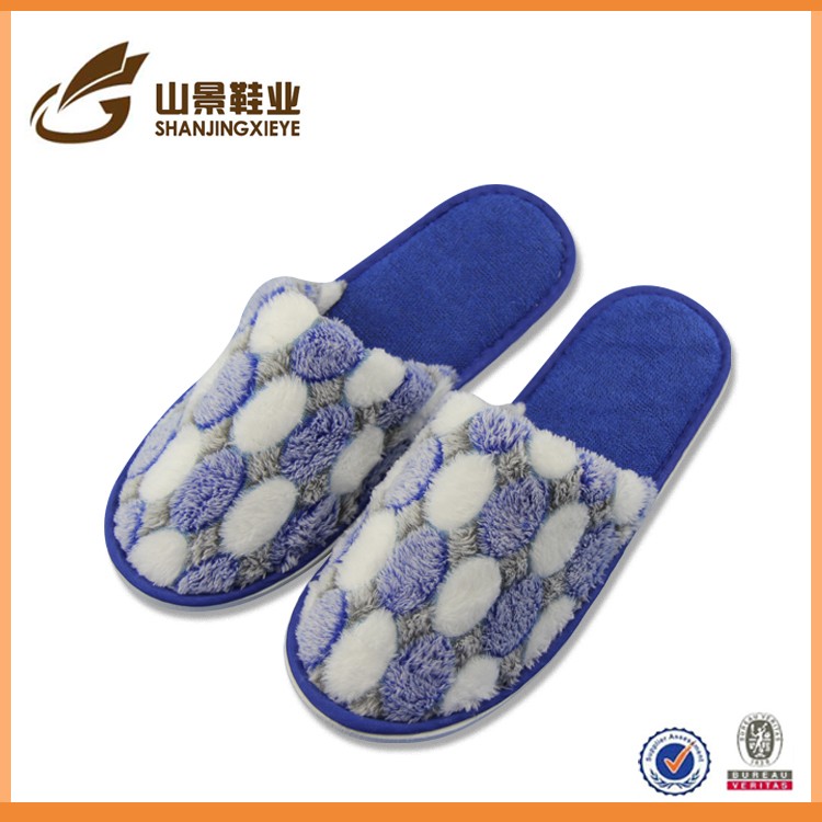 Large supply of low-cost household terry cloth indoor slippers